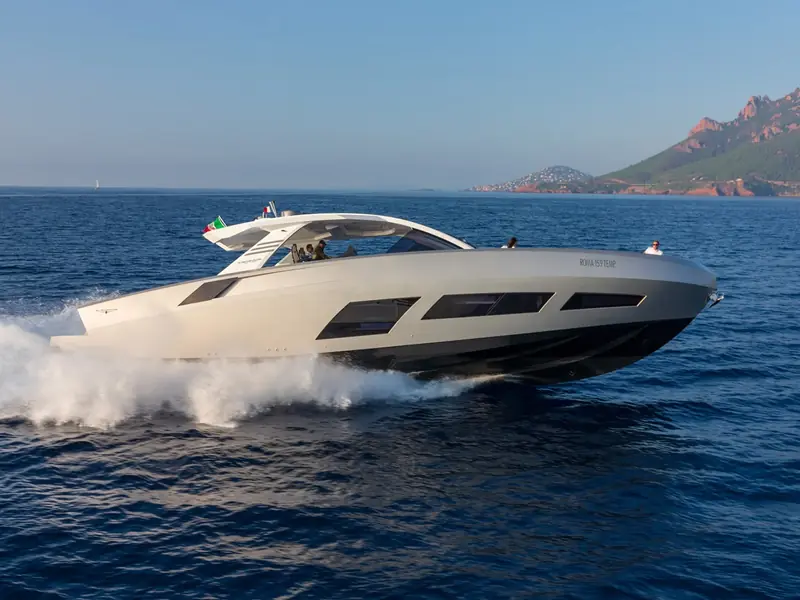 NEXT yacht cruising at speed on the open sea with a wake behind the hull.