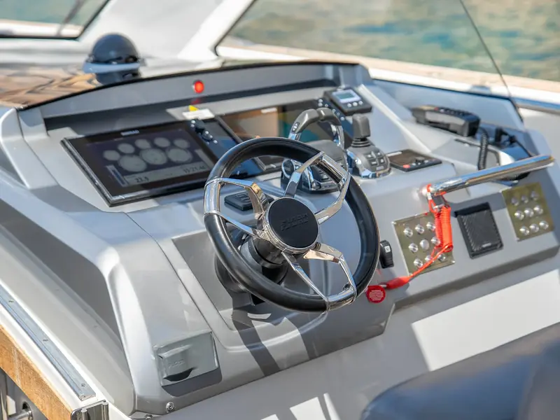 PETITCHET helm station with Simrad displays, joystick control, and a Fjord branded steering wheel.