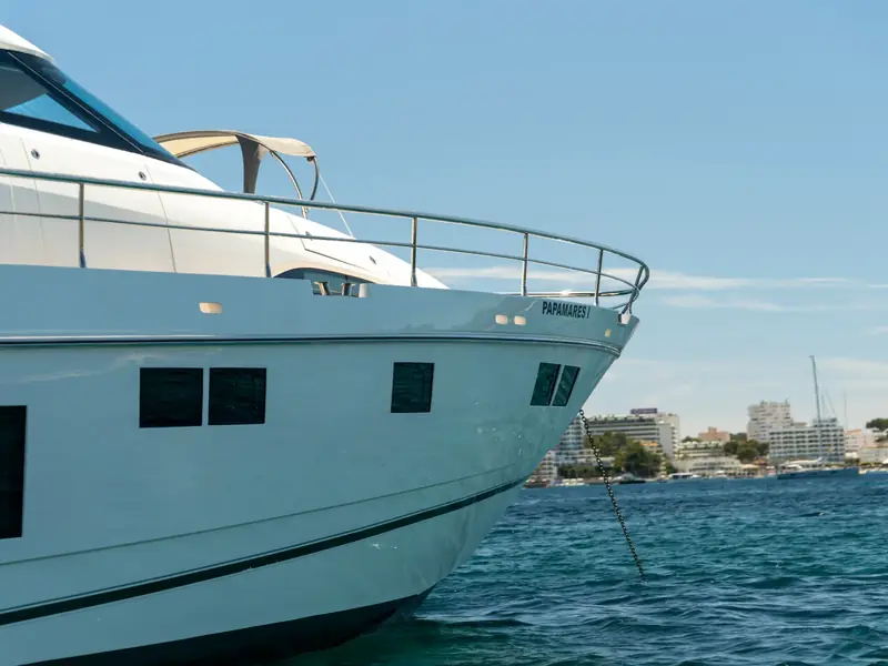PAPAMARES yacht bow and hull detail showing the anchor chain and port side windows at sea.