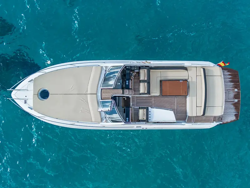 CUCA, a Windy 39 Camira, seen from a top-down aerial perspective on blue water.